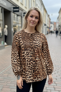 Leopard blus leende